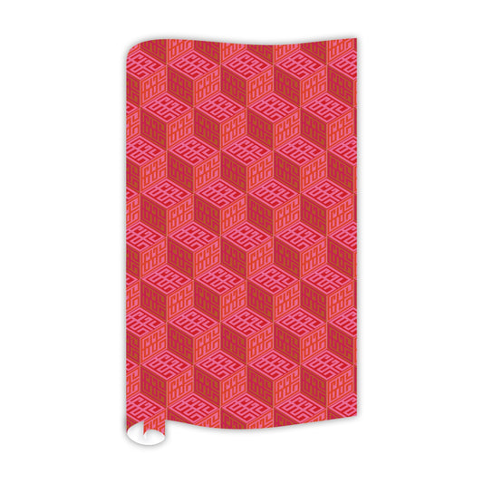 Gift wrap with a red and pink geometric design, showcasing a repeating cube pattern filled with intricate lines. The continuous roll is partially unrolled, displaying a visible bottom curl.