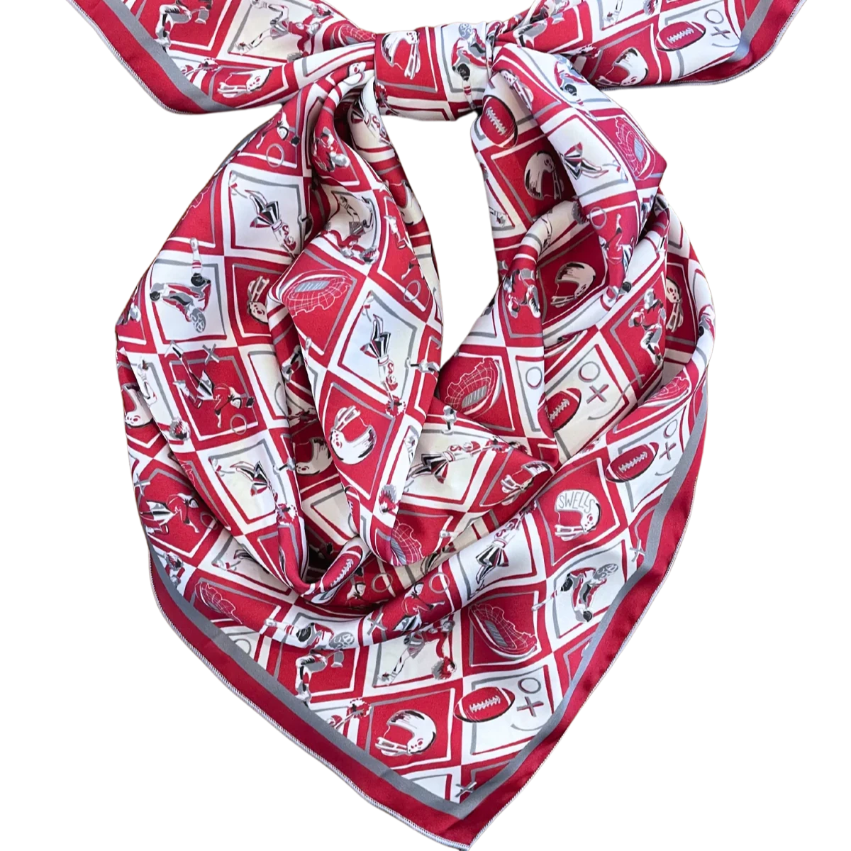 The Gameday Scarf - Crimson & Grey Checkerboard is a handmade piece featuring a sports-themed pattern with footballs, baseball bats, and helmets arranged in a geometric design. Neatly tied in a knot, this vibrant Montreal scarf beautifully showcases its intricate design.