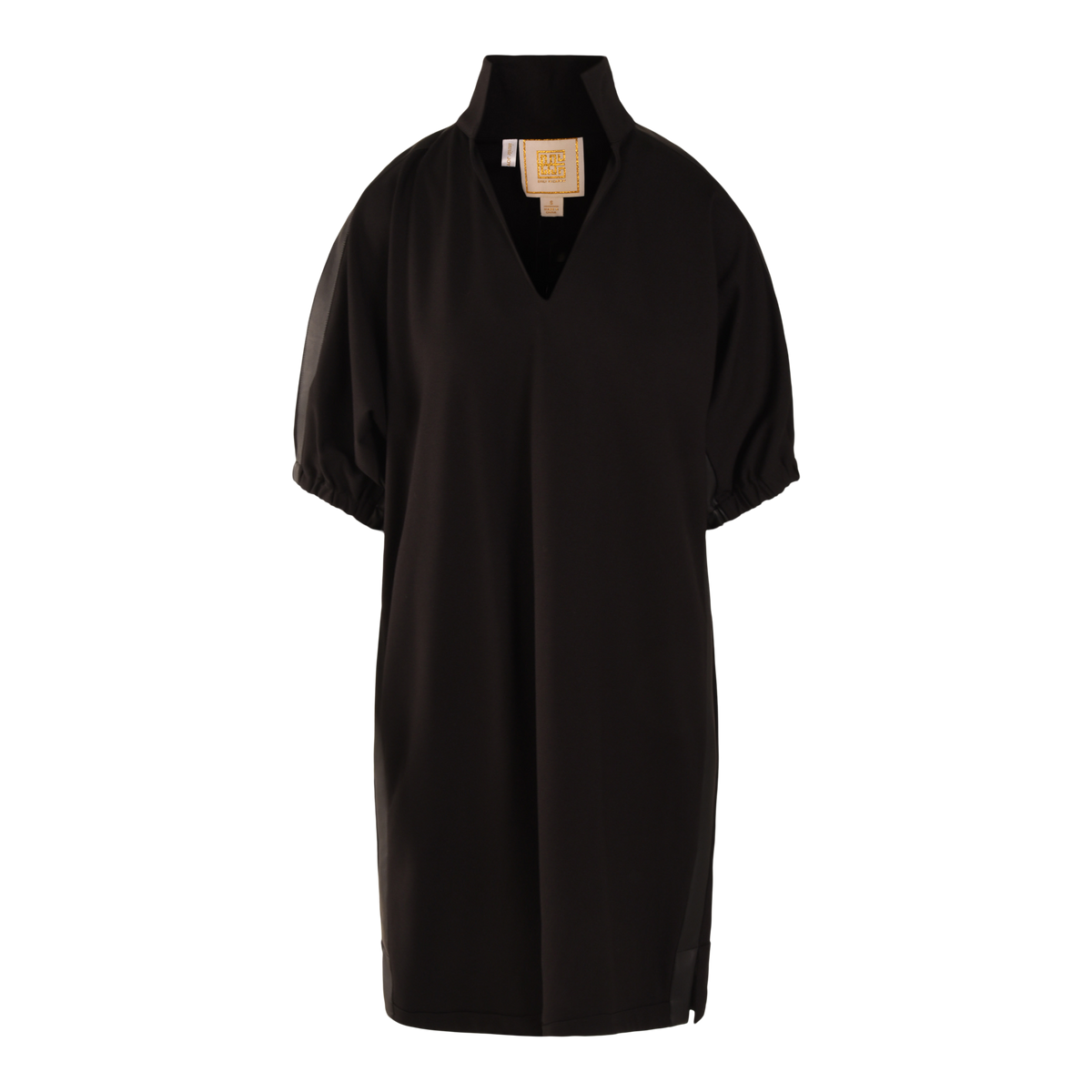 The Poppy Dress is a black Ponte, short-sleeved, knee-length dress with a loose fit, high collar, V-shaped neckline, gathered sleeve cuffs, and an inner collar label.