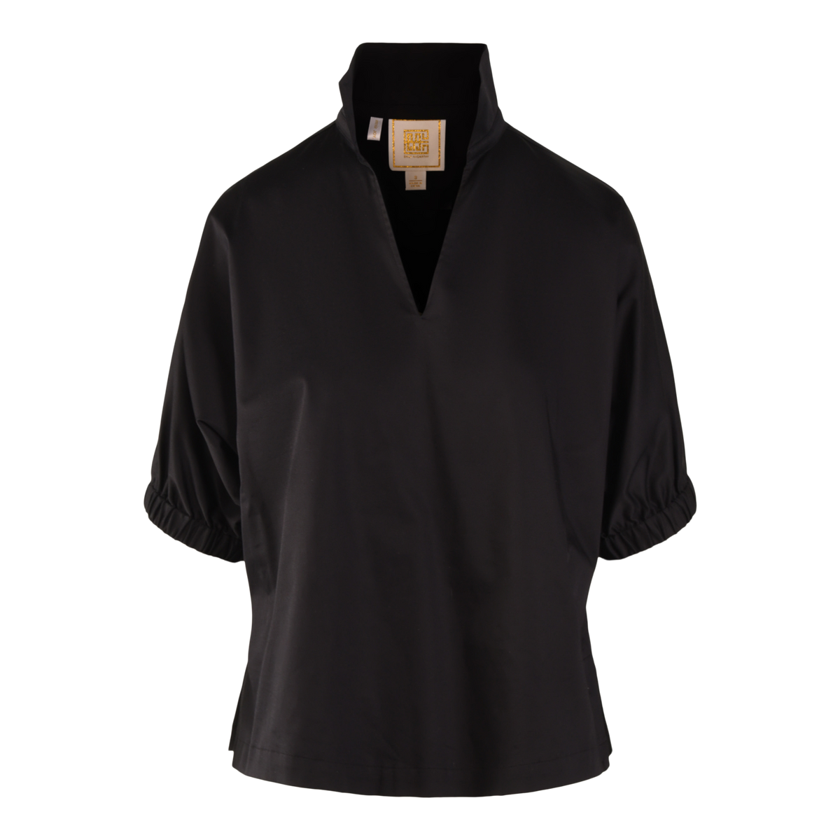 The Poppy Top is a black short-sleeve blouse made from soft Black Ponte, featuring a high split neckline, gathered elastic cuffs, and a relaxed fit. It is shown against a plain white background.
