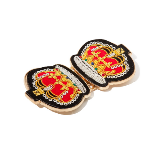 A crown-shaped embroidered patch, ideal for the Drama Queen Belt, showcases vibrant red, gold, and black hues with exquisite detailing and metallic threads. It's a majestic addition to any outfit, empowering you to confidently embrace your inner queen.