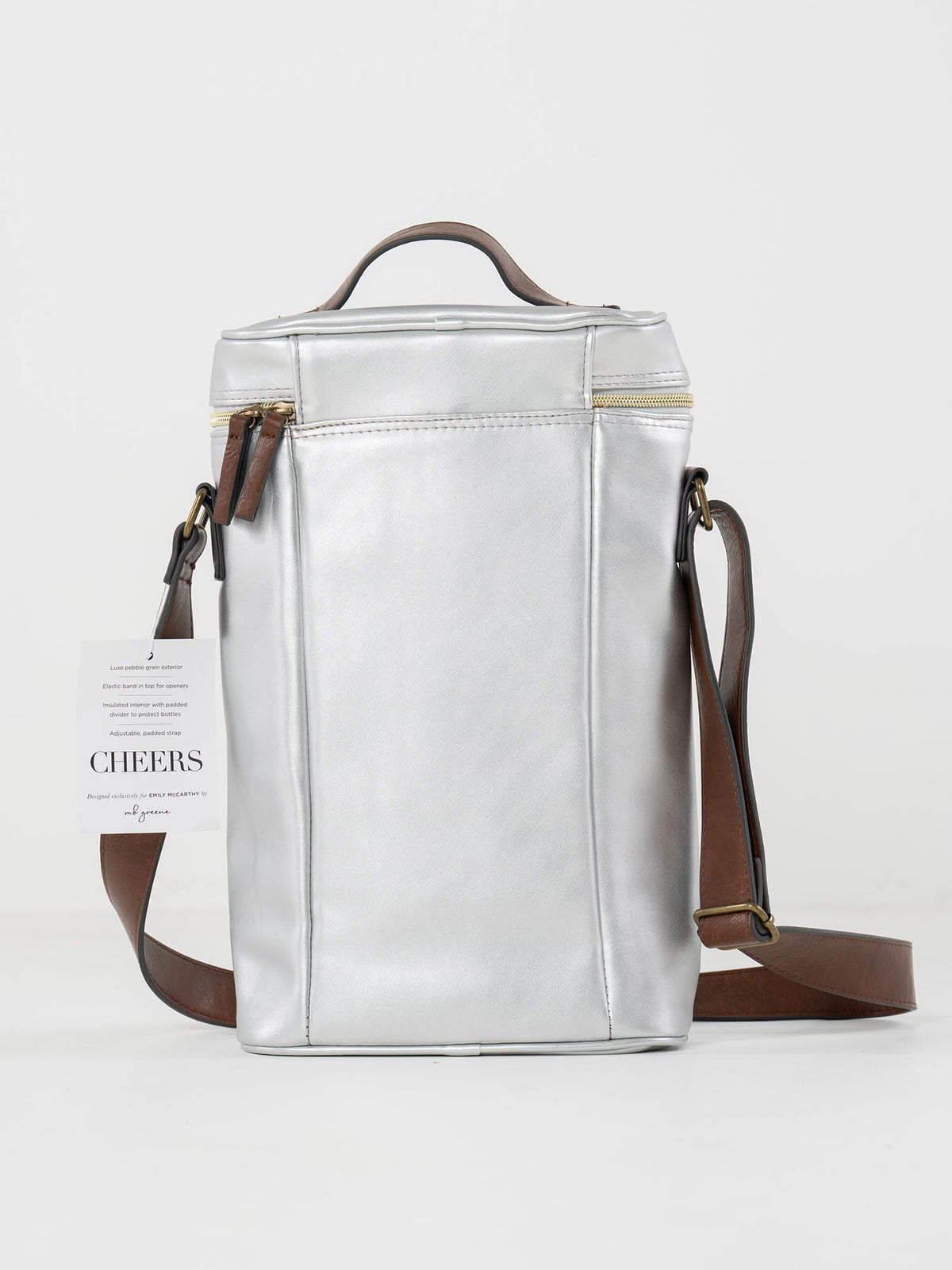 The Insulated 2-Bottle Wine Bag features metallic silver leather, a brown adjustable shoulder strap, top handle, zippered pocket, and a white CHEERS tag on the side. The stylish wine carrier is shown against a plain white background.