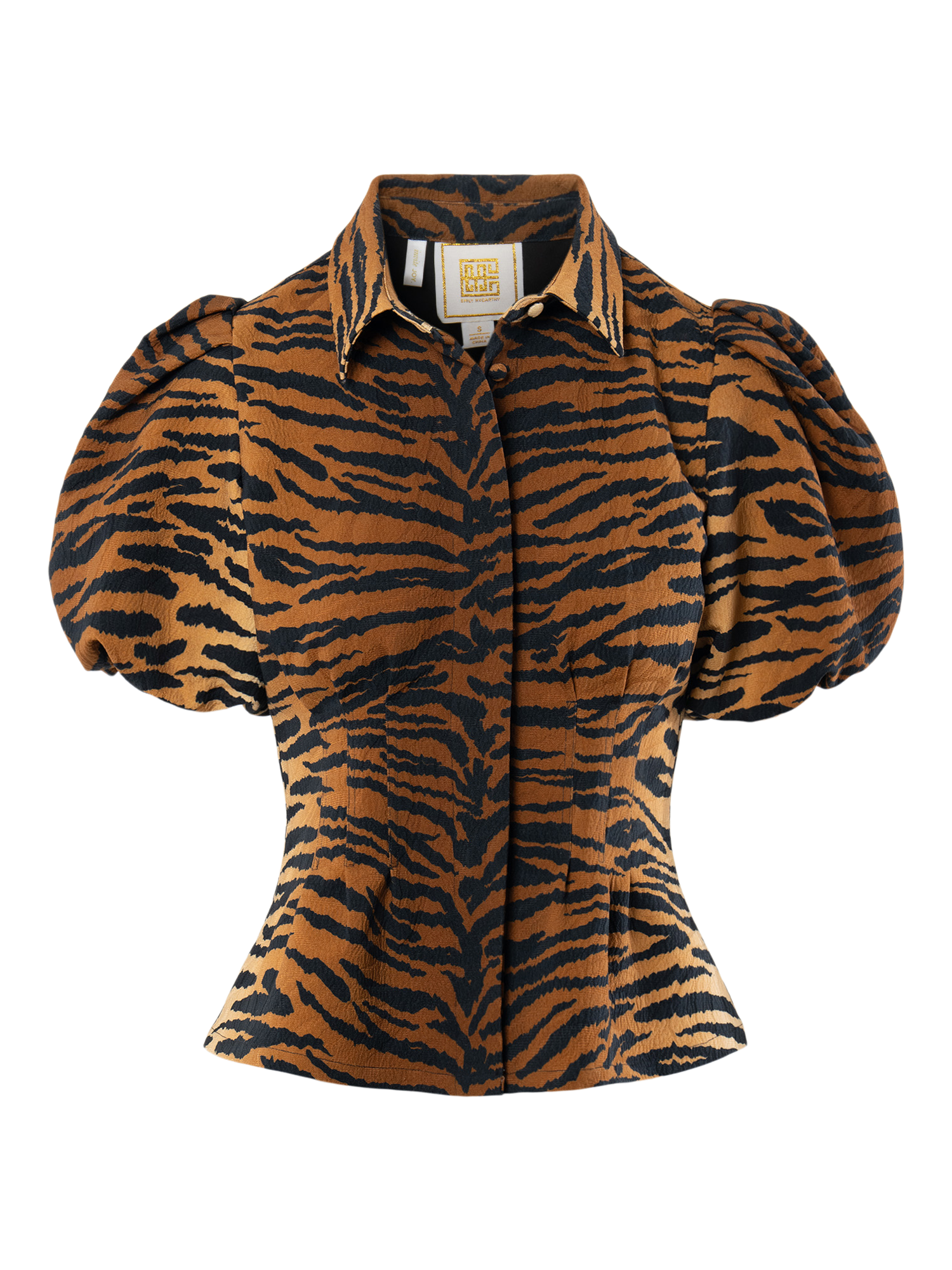 The Britt Top features a brown and black tiger print, puff sleeves, a pointed collar, button-down front, and a tailored silhouette that flatters the waist.
