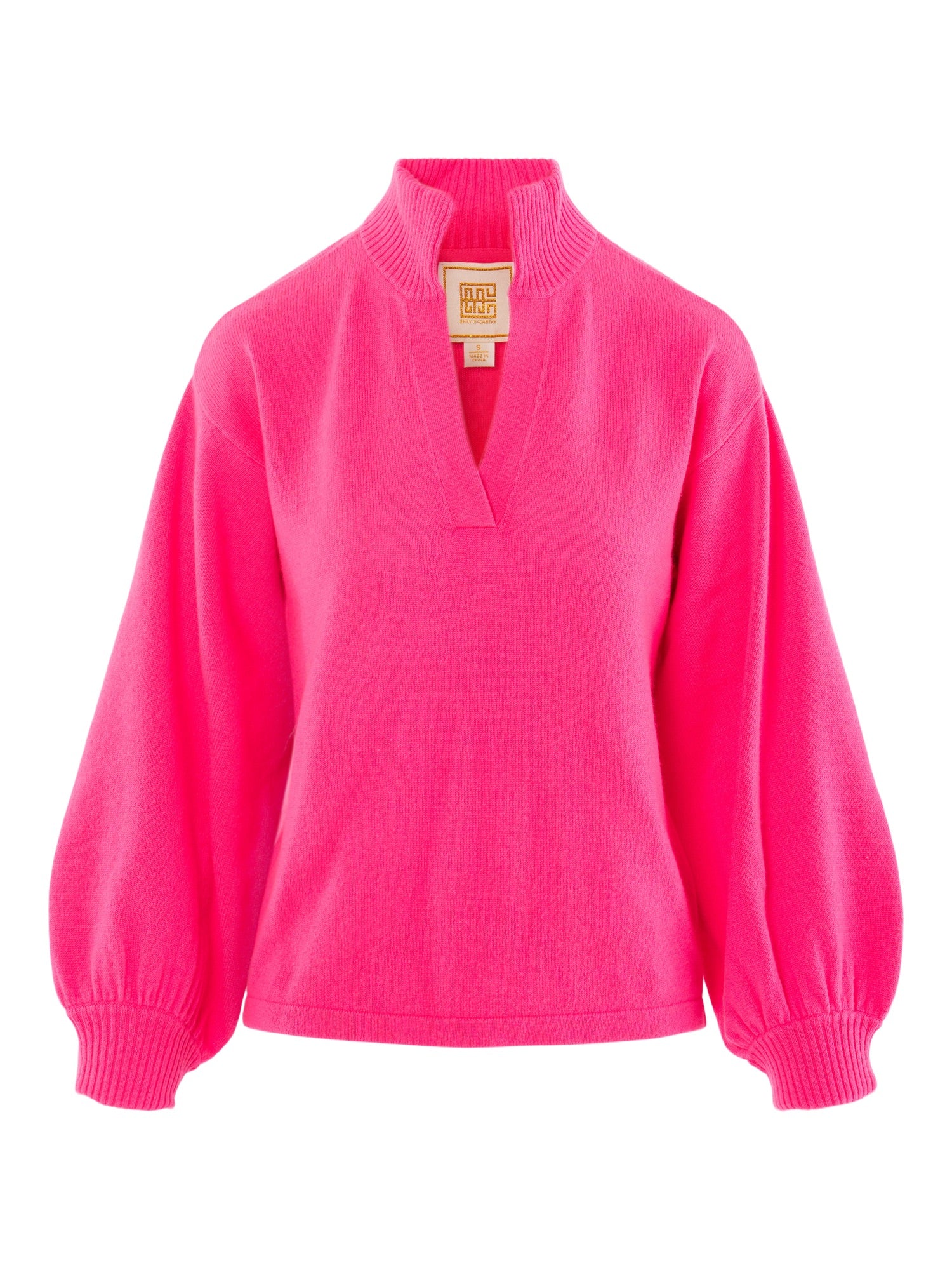 The Lolli Sweater, a bright pink women's luxury top with a high ribbed collar, deep V-neckline, balloon sleeves, and ribbed cuffs, is displayed on a plain white background.