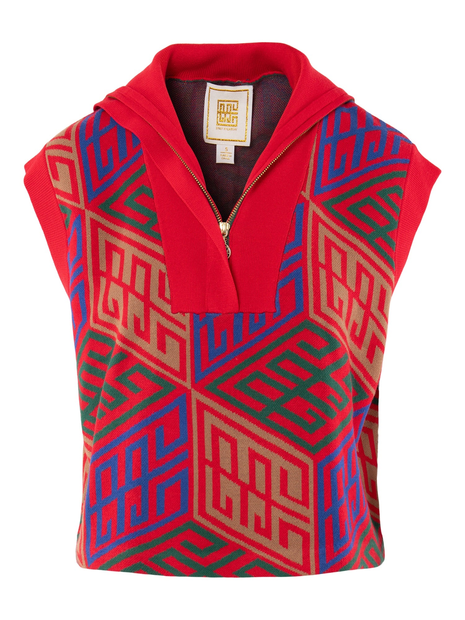 The Poppy Pullover Vest is a sleeveless vest with a red zipper collar and bold geometric pattern in red, blue, green, and tan. It features a repeating interlocking motif and a fabric tag at the neck.