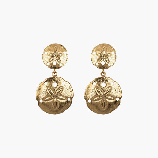 The Marinae Earring - Gold features a dangling design with two sand dollar-shaped discs, each embellished with star-like details and small cutouts. These 18K gold-plated earrings are ideal for sensitive skin due to their nickel-free composition.