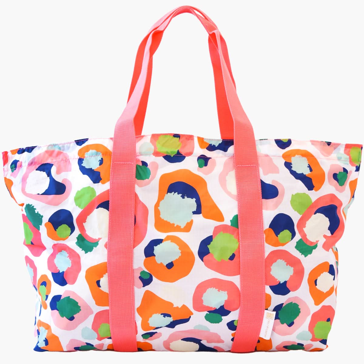 Introducing the Travel Tote - Multi Spot Cheetah from the Emily McCarthy Collection, showcasing a lively design with abstract patterns in orange, blue, green, and pink hues. This tote features durable bright pink handles and is crafted from lightweight material, making it ideal for stylishly carrying your essentials or as a reliable travel companion.