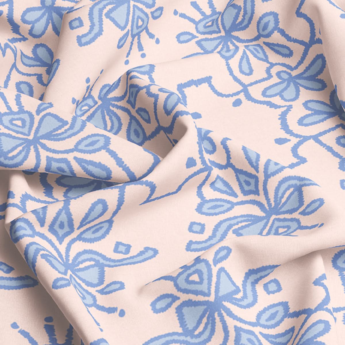 A detailed view of the Fabric by the Yard - Bow Royalty reveals a light beige backdrop embellished with hand-drawn, soft blue floral and geometric motifs. Crafted from an upholstery weight blend of cotton and linen, the fabric is gracefully folded to highlight its elaborate design.