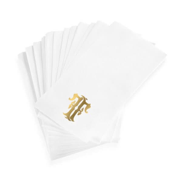 A stack of 1-Letter Monogrammed Guest Towels, made of white linen-textured paper and each adorned with a gold ornate A monogram in the lower corner.