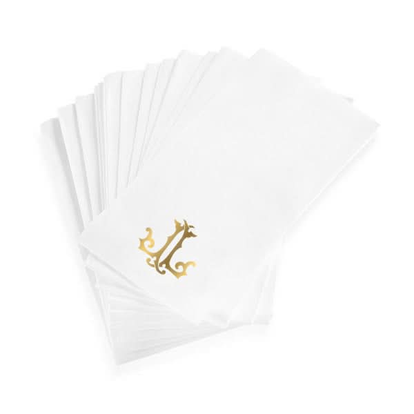 A stack of 1-Letter Monogrammed Guest Towels is fanned out, each with a gold ornate L in the corner.
