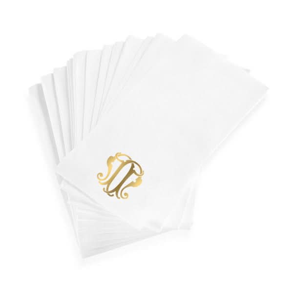 The 1-Letter Monogrammed Guest Towels are white linen-textured paper towels, each with a gold ornamental N monogram in the corner.