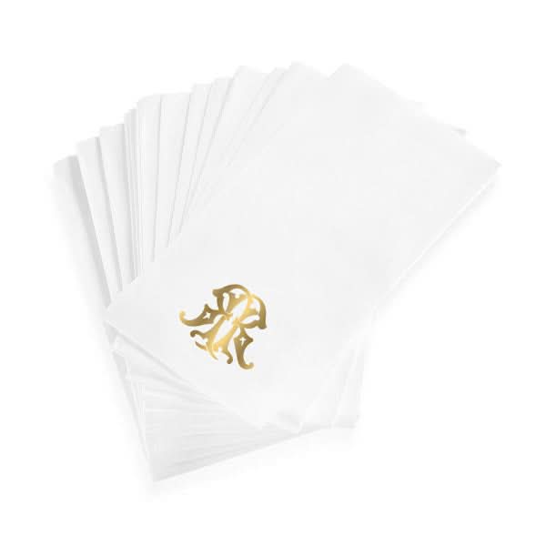 A stack of 1-Letter Monogrammed Guest Towels made from white linen-textured paper, each featuring a gold monogram in the corner.