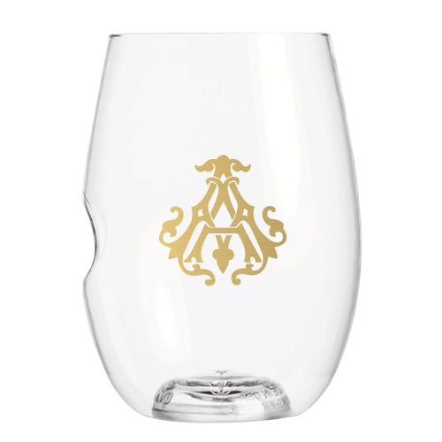 The 1-Letter govino® Stemless Shatterproof Wine glass showcases a gold ornate monogram or logo design on one side. This clear, reusable, and shatterproof glass features a slight indent for ergonomic grip against a plain white background.