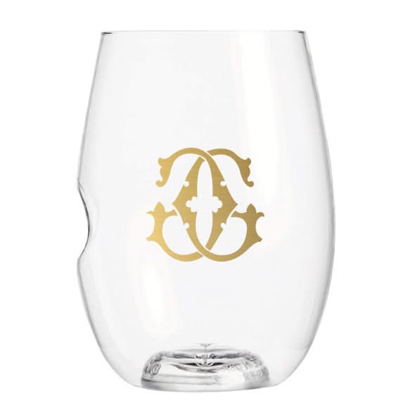 This 1-Letter govino® Stemless Shatterproof Wine Glass features a clear design with a gold decorative monogram on its front. Known for being reusable, the glass includes a unique side indentation for an easy grip.