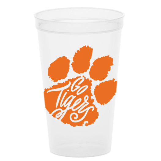 The Go Tigers Stadium Cups - Orange showcase a transparent design with an orange paw print and the words "Go Tigers" inside. Perfect for tailgate parties, these sleek cups stand out against a plain white background, capturing team spirit in style.