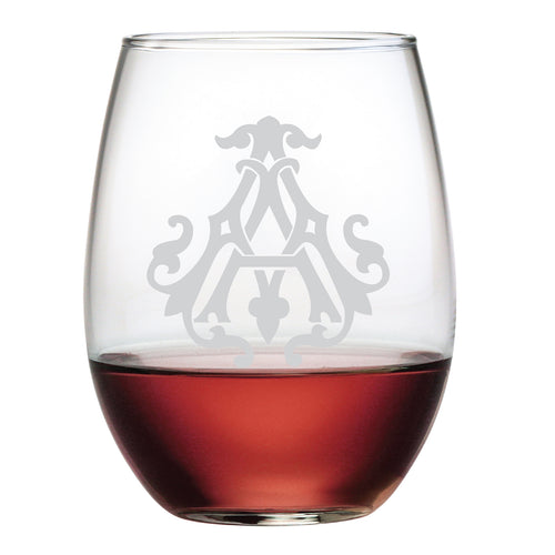 The 1-Letter Etched Initial Stemless Wine Glass features a stunning, ornate gray monogram design on its surface, beautifully displayed with red wine. Its an ideal gift for wine enthusiasts.