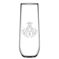 A tall 1-Letter Monogrammed Stemless Champagne Flute features a clear glass with a centrally etched symmetrical emblem and an intricately engraved initial, exuding elegance.