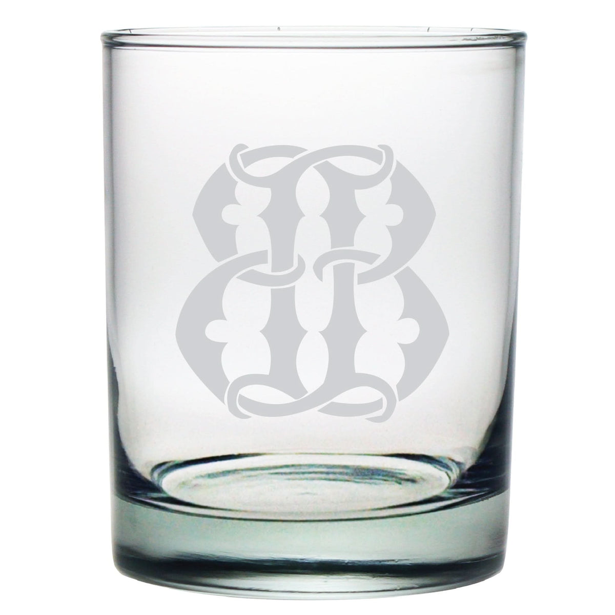 The 1-Letter Monogrammed Lowball Glass, featuring a large ornate intertwined letter B etched in monogram style, is an exquisite gift.
