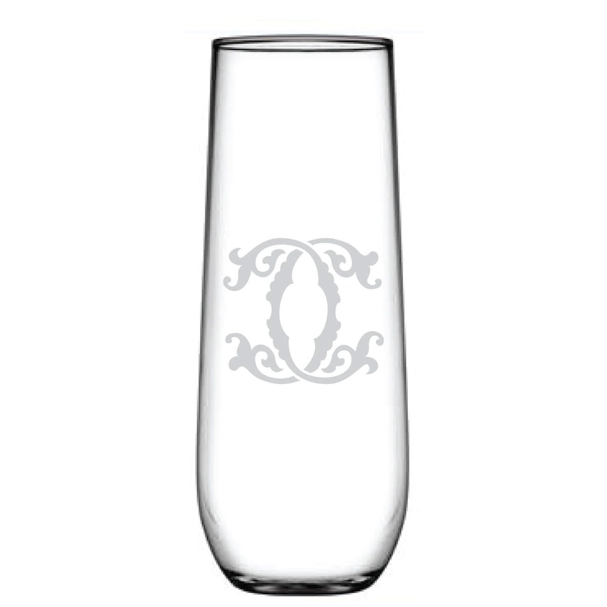 The 1-Letter Monogrammed Stemless Champagne Flute is a tall, clear glass with a cylindrical shape and smooth, reflective surface. It features an intricate swirling design etched centrally, resembling a delicate personalized initial.