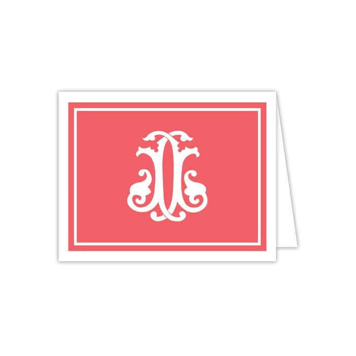 A folded notecard from the Gift Bar collection showcases a coral red front with a detailed white monogram design. This card is part of a set of 10 and is enhanced by a white border around the edge, paired with matching envelopes for an impeccable presentation.