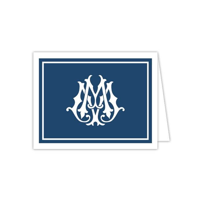 Product Description: The Gift Bar - Folded Note comprises a set of 10 greeting cards featuring a dark blue cover adorned with an ornate white monogram design at the center. Each card is slightly open to reveal a blank white interior, ideal for personalizing your message. Complement them with matching envelopes to create a complete stationery ensemble.