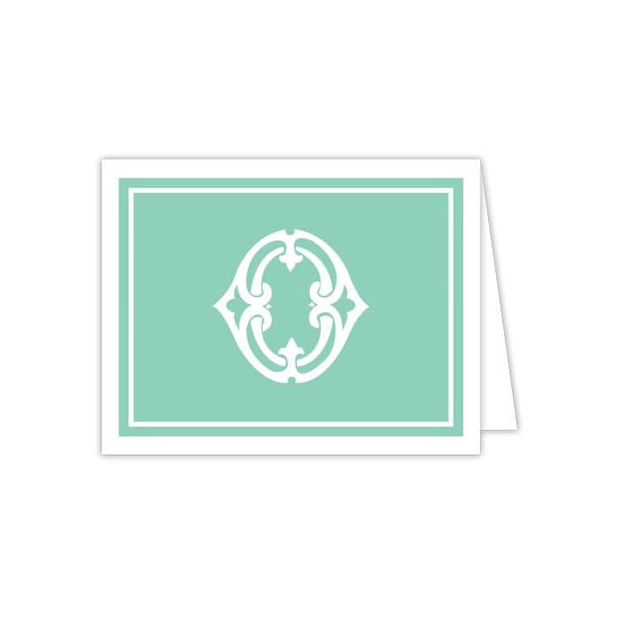 A set of 10 folded Gift Bar - Folded Note cards showcases a turquoise background adorned with a white decorative emblem at the center. This sophisticated design, accented by a white border, makes it ideal for any occasion. The card is depicted in a partially open state and pairs elegantly with matching envelopes.