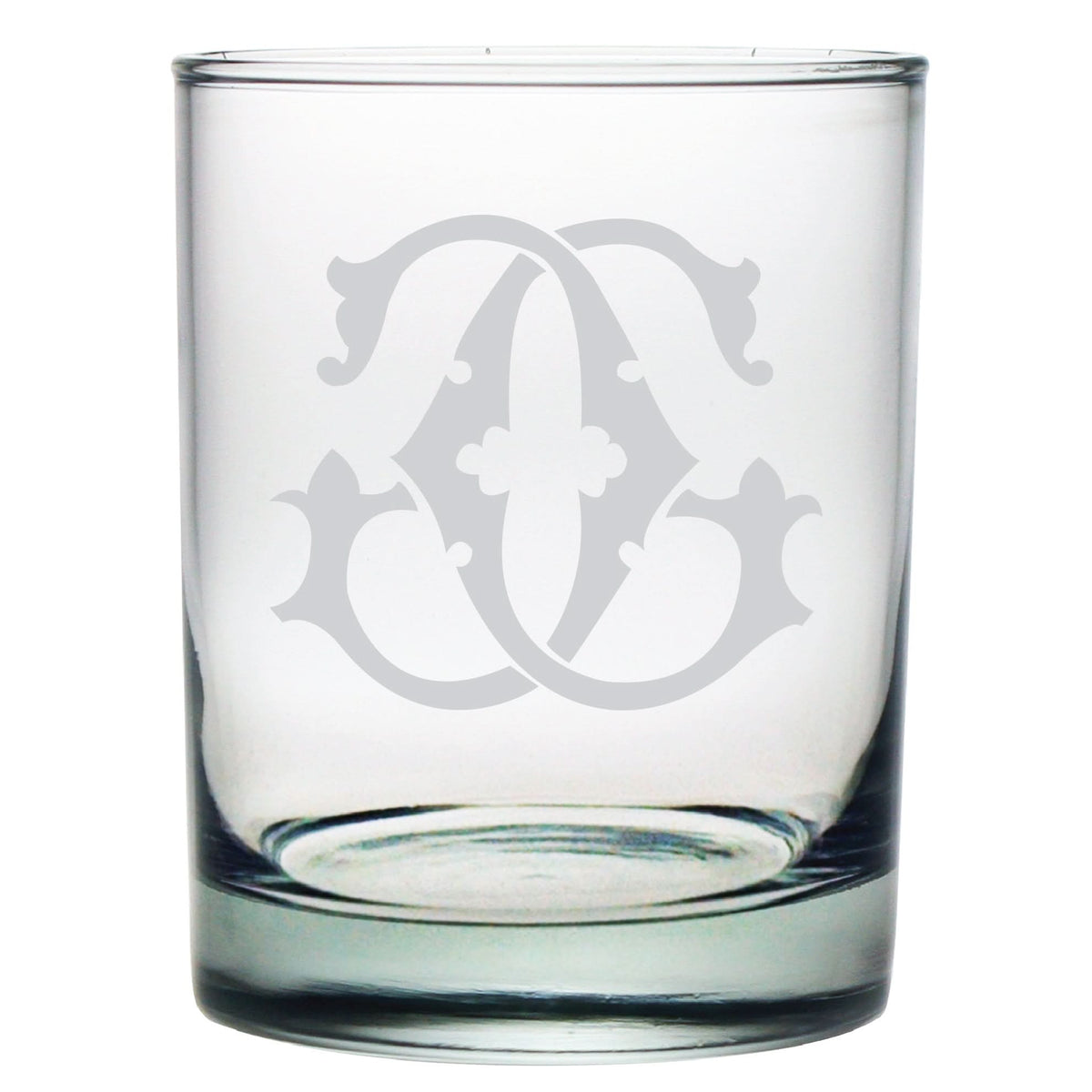 The 1-Letter Monogrammed Lowball Glass is a clear glass cup with an ornate interlocking letter design etched on the side. Its monogram features decorative curved lines and a central floral element, creating an elegant appearance—perfect for any occasion.