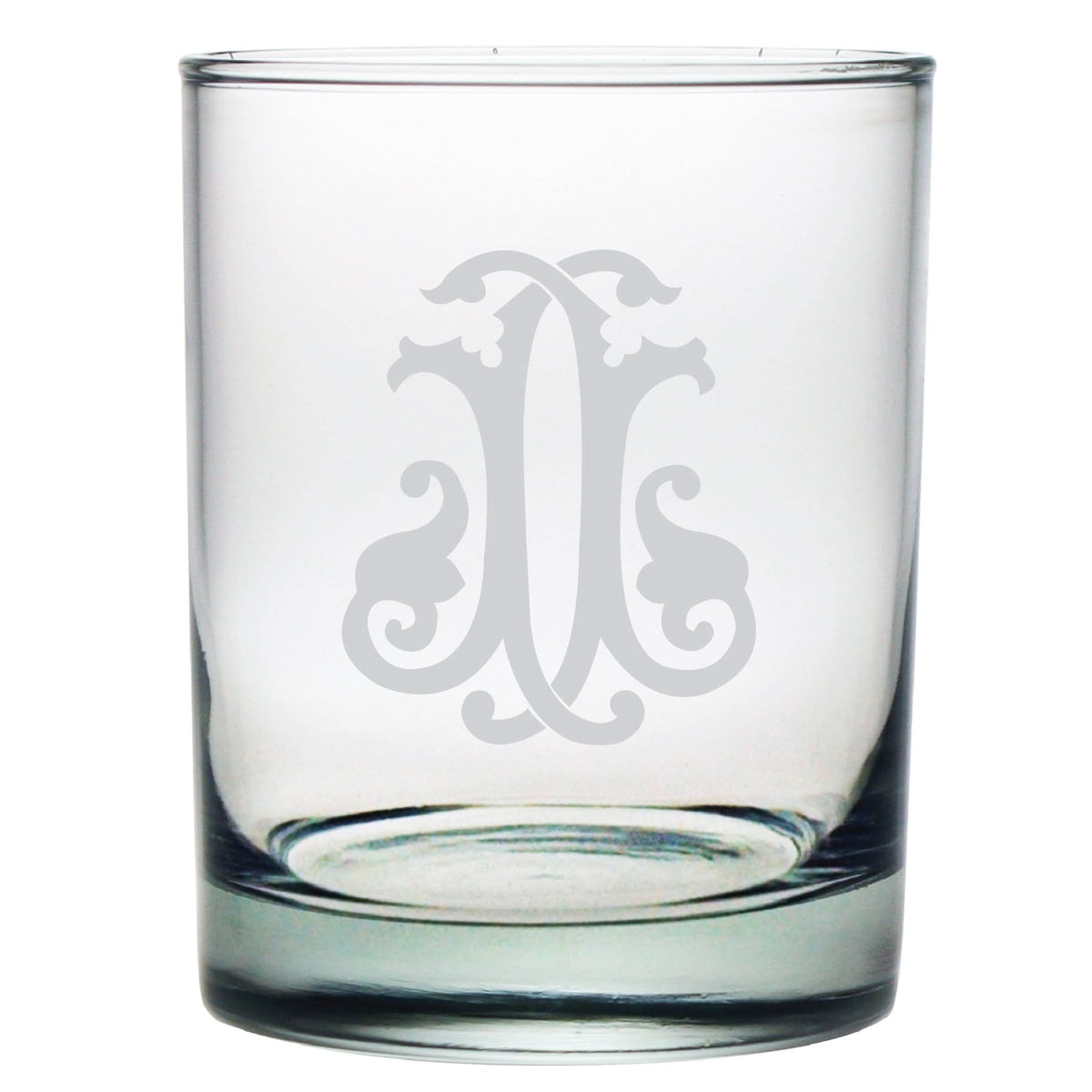The 1-Letter Monogrammed Lowball Glass features a clear, cylindrical design with a thick base and intricate, symmetrical etchings resembling a monogram-style emblem, making it an elegant gift.