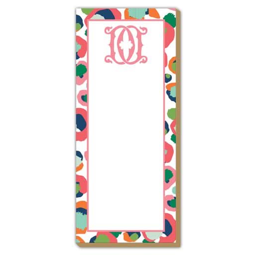 Introducing the Gift Bar - Luxe Skinny Pad, a decorative notepad measuring 3.5 x 8.5 inches. It boasts a multicolored border with abstract floral patterns in pink, green, navy, and orange. Crafted from durable 100# card stock, the pad features a pink stylized letter "O" adorned with a fleur-de-lis design at the top for an elegant touch.