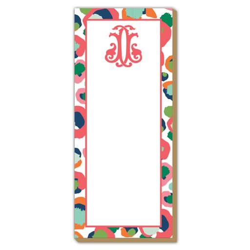 The Gift Bar - Luxe Skinny Pad is a decorative notepad crafted on premium 100# card stock, featuring a pink monogram J at the top. It measures 3.5 x 8.5 inches and is adorned with colorful abstract shapes in vibrant shades of blue, green, pink, and orange along its border.