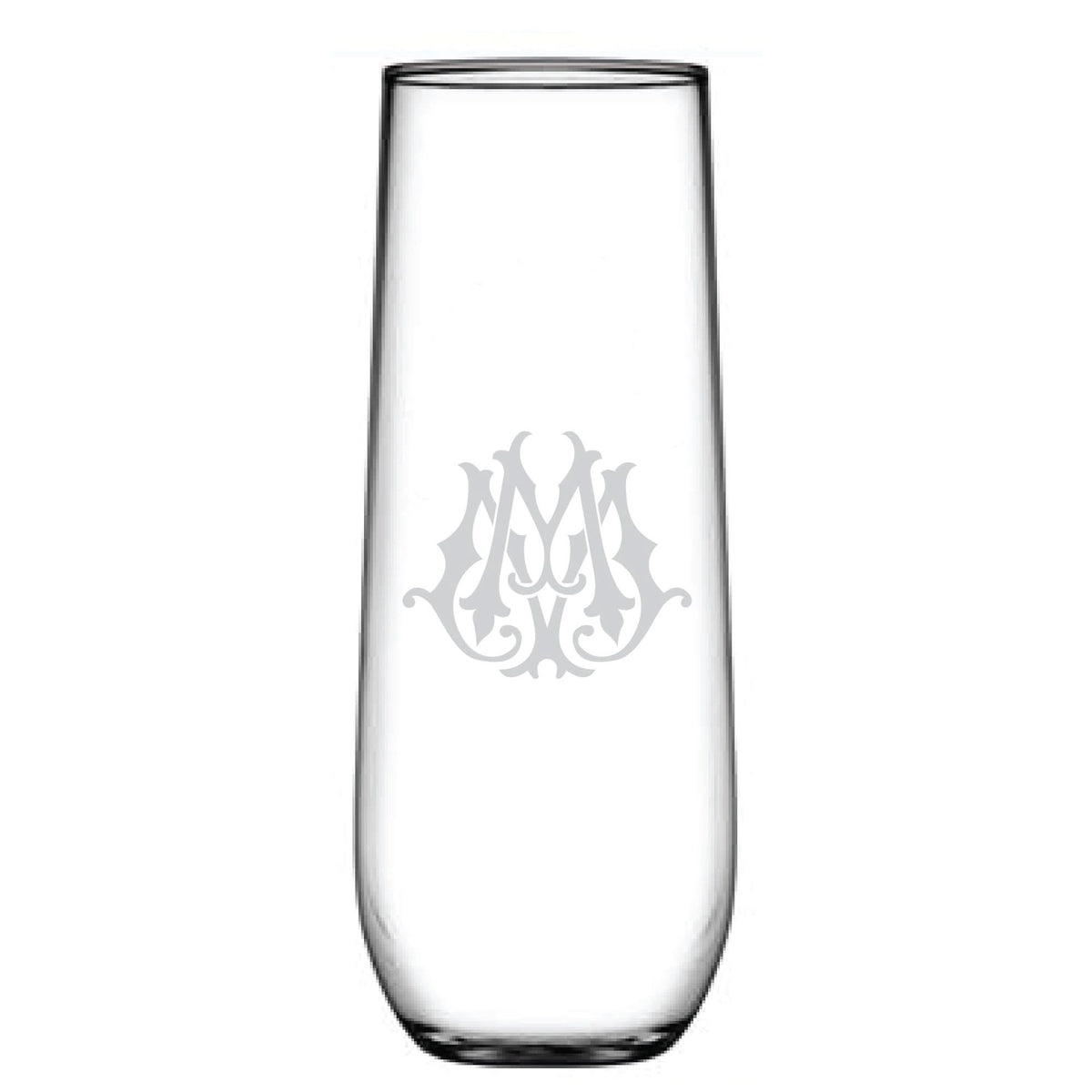A tall, clear 1-Letter Monogrammed Stemless Champagne Flute features a decorative letter M etched on the front. The intricate design adds elegance, transforming it into a sophisticated piece for any celebration.