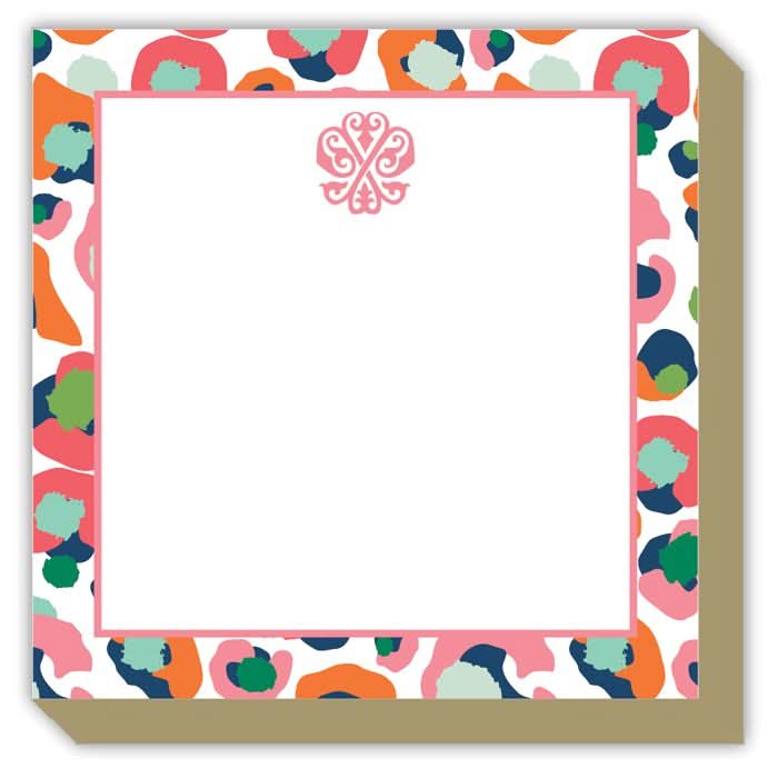 Introducing the Gift Bar - Mini Luxe Notepad: A stack of 100 sheets, each measuring 4 x 4 inches, featuring a vibrant abstract border adorned with pink, orange, green, and blue shapes. An elegant pink ornamental design embellishes the top center, leaving ample blank space for your notes.