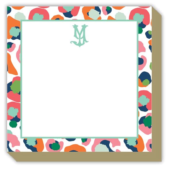 The Gift Bar - Mini Luxe Notepad features a 4 x 4 square design with 100 sheets, colorful abstract borders in red, orange, teal, navy, and green, a white center with a light green monogram M, and stylish subtly raised edges.