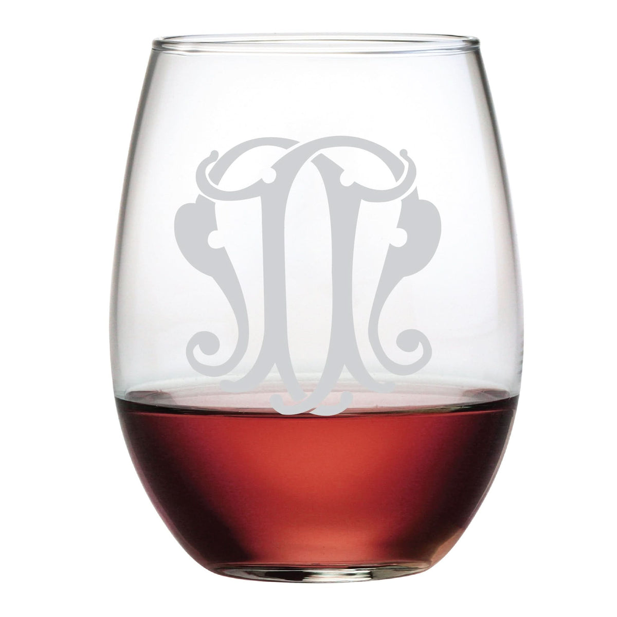The 1-Letter Etched Initial Stemless Wine Glass is partially filled with red wine and features a frosted, monogram-style design. Its ornate pattern makes it an elegant gift choice against a plain white background.