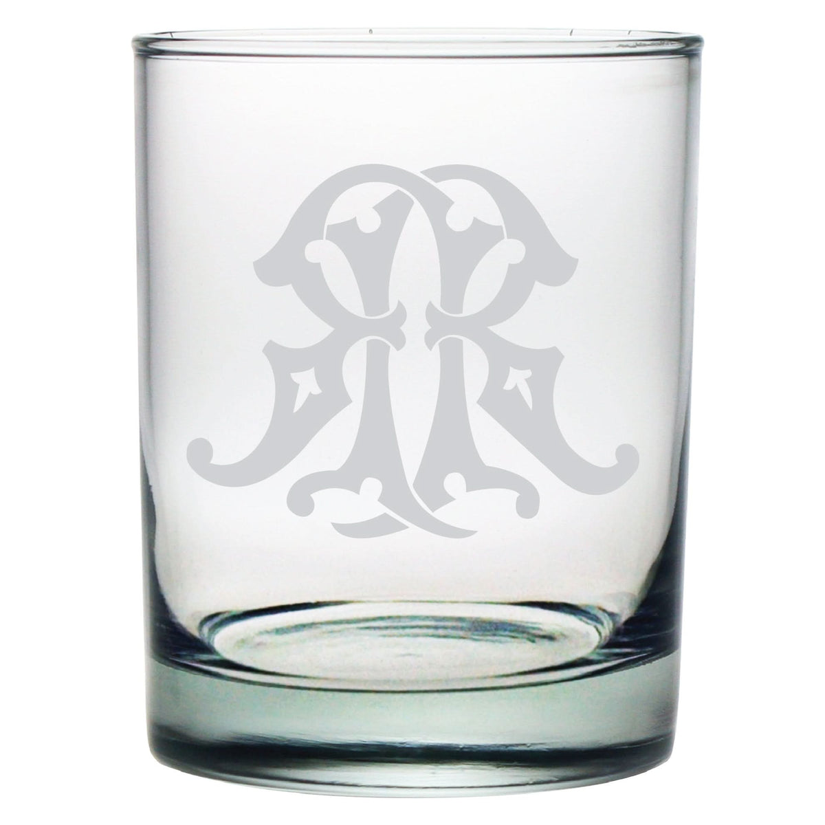 The 1-Letter Monogrammed Lowball Glass features a clear design with an ornate white flourish engraved in monogram style, adding elegance to its simple look. Its symmetrical and intricate pattern makes it an ideal gift for any occasion.