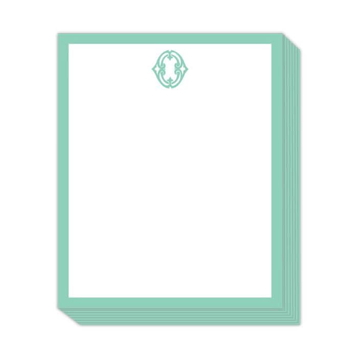 The Gift Bar - Short Stack Pad features a stylish presentation of sheets measuring 5.25 x 6.5", adorned with a teal border and an intricate teal emblem at the top center.