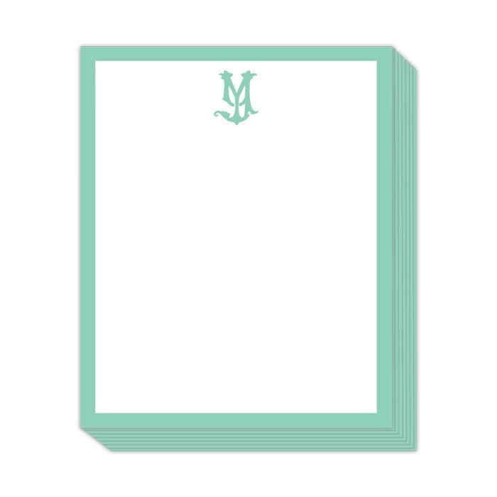 The Gift Bar - Short Stack Pad features premium white notepad sheets, each 5.25 x 6.5 inches, with a mint green border and a decorative letter M at the top center.