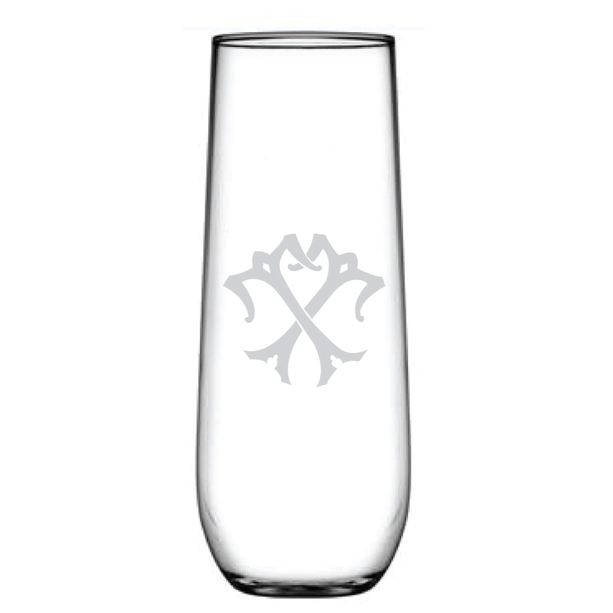 A tall, clear stemless champagne flute with a decorative, symmetrical monogram etched on the front. The emblem features abstract shapes and lines forming a stylized design, creating an elegant etched glass look.